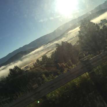 You realise the altitude you're at when you are driving above the clouds